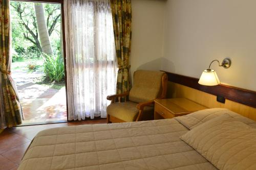 Ein Bett oder Betten in einem Zimmer der Unterkunft Hotel Restaurant Papillon