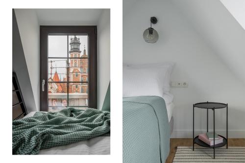 - une chambre avec un lit et une fenêtre dans l'établissement BY THE RIVER apartments, à Gdańsk