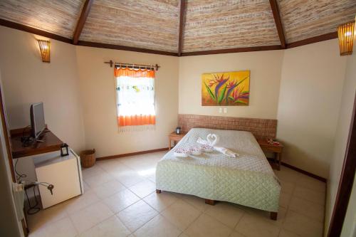 Hotel Pousada Imbassaiにあるベッド