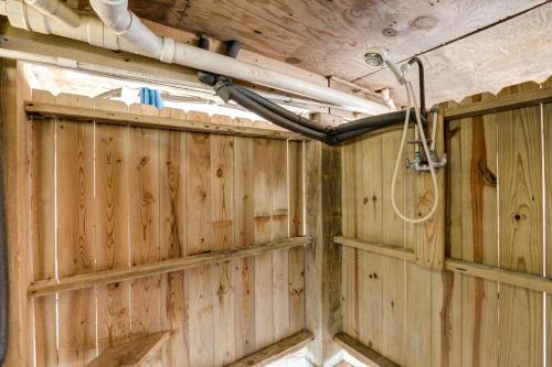 a room with a wooden wall with a shower in it at Serenity #294-F in Frisco