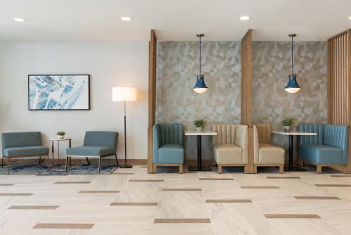 a waiting room with chairs and tables in a hospital at Holiday Inn & Suites Ocean City by IHG in Ocean City