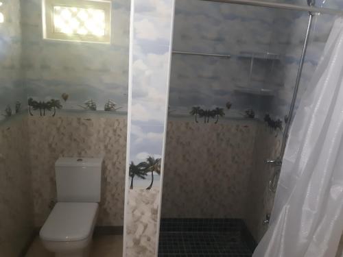 A bathroom at La Residence D'Almee Guesthouse