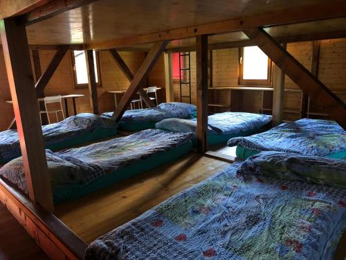Un pat sau paturi într-o cameră la Villaggio di vacanza TCS