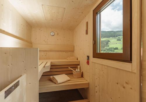 a small sauna with a window in a tiny house at Unser Hoamat Appartement in Schladming