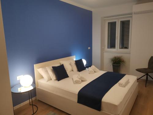Posteľ alebo postele v izbe v ubytovaní Marina Rijeka Center apartments