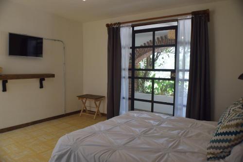 Cama ou camas em um quarto em Finca del Pomar