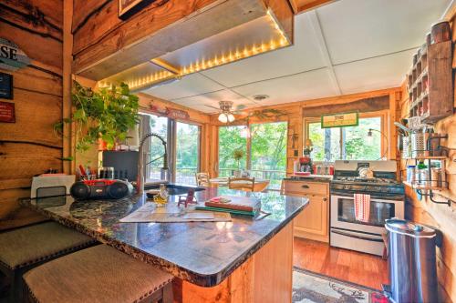 a kitchen with a large counter top in a house at Adirondack Mountains Cottage Near Gore Mountain! in Warrensburg