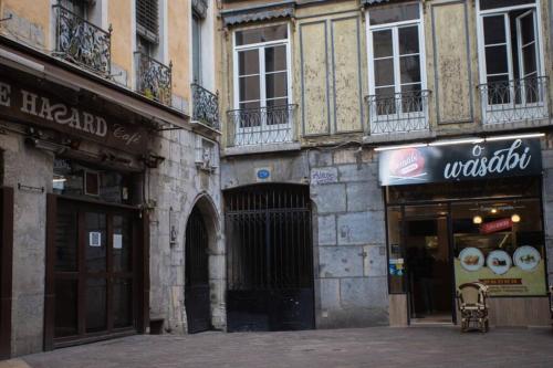 an empty street in a city with buildings at Le Bohème, Cosy, Hypercentre in Grenoble