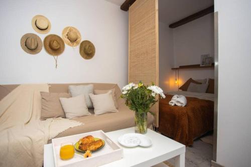 a living room with a couch and a table at Le Bohème, Cosy, Hypercentre in Grenoble