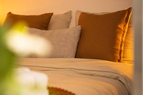 a close up of a bed with pillows at Le Bohème, Cosy, Hypercentre in Grenoble