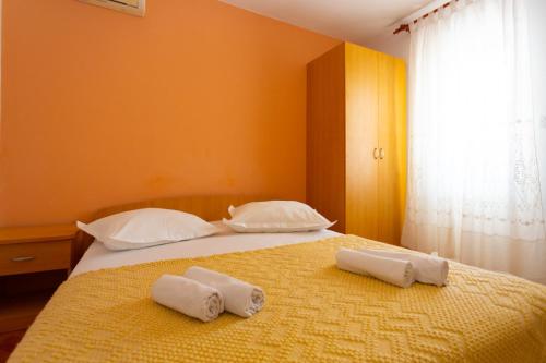 Posteľ alebo postele v izbe v ubytovaní Apartmani Vranjes 2