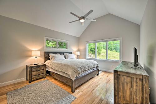 a bedroom with a bed and a ceiling fan at Slopeside Jackson Townhome on Black Mountain in Jackson