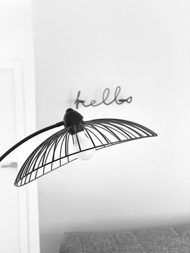 a black and white photo of an umbrella with the word hello at Alcarria , Casa del Agua in Albalate de Zorita