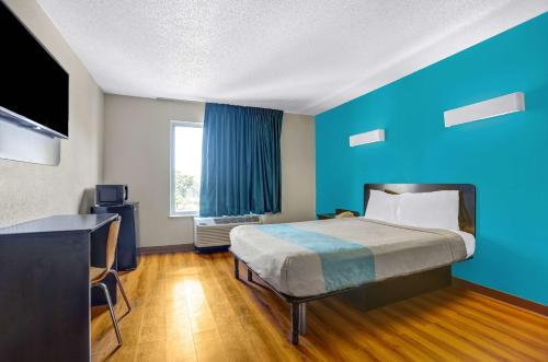 Una cama o camas en una habitación de Motel 6-Raleigh, NC - North