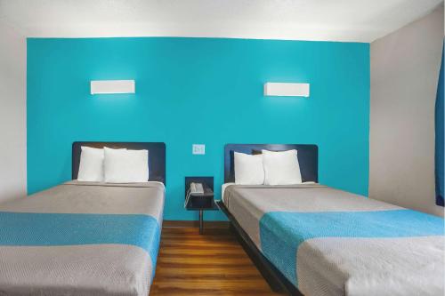 Una cama o camas en una habitación de Motel 6-Raleigh, NC - North