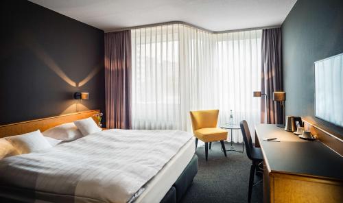 Tempat tidur dalam kamar di Best Western Hotel Kaiserslautern