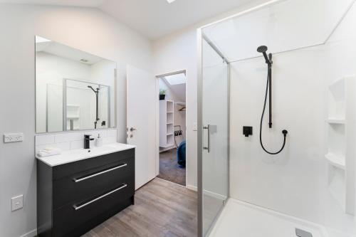 a bathroom with a sink and a shower at Shotover Country piece of paradise in Queenstown