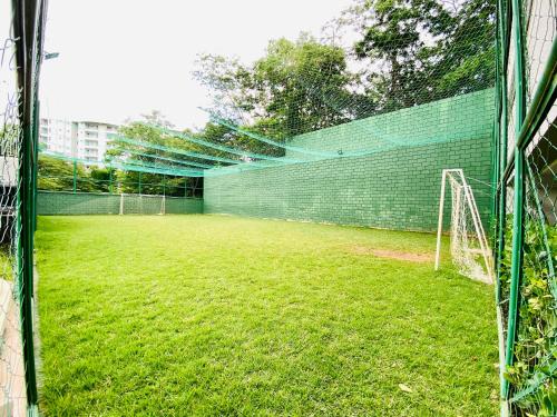 a soccer field with a net and a goal at Flat 303 - Condomínio Park Veredas - Acesso ao Rio - Completo com ar no quarto e na sala in Rio Quente