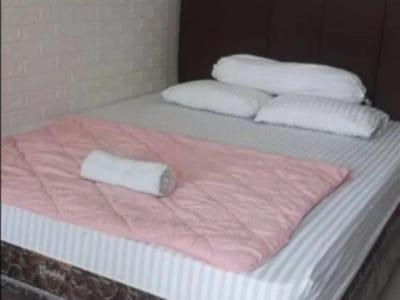 Postel nebo postele na pokoji v ubytování Apartemen Springlake Summarecon Bekasi-By Bu Johan