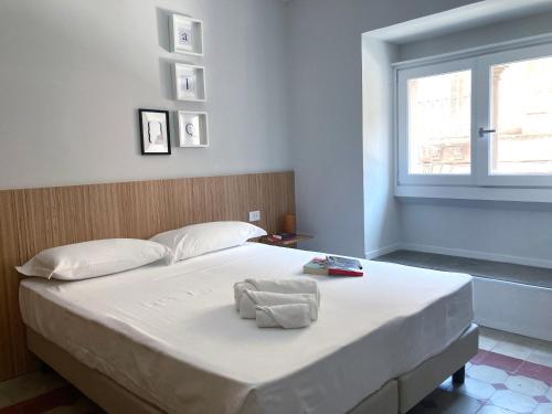 Postel nebo postele na pokoji v ubytování Sognalibro Bed and Books