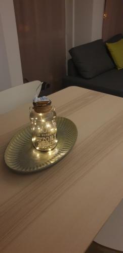 a jar with lights on top of a bed at Cattleya's Loft in Veliko Tŭrnovo