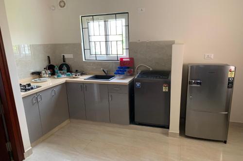Η κουζίνα ή μικρή κουζίνα στο Vennela Hotel Apartments