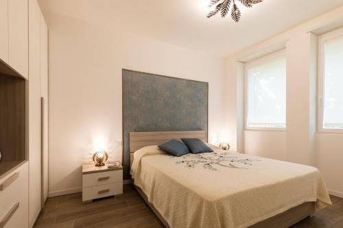 Gulta vai gultas numurā naktsmītnē West Milan - Modern and Comfortable Apartment