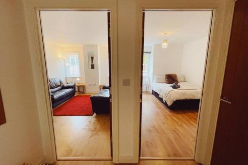 an open door to a living room with a couch at 1 Bedroom City Centre Apartment - Sleeps 4 Free Parking in Newcastle upon Tyne