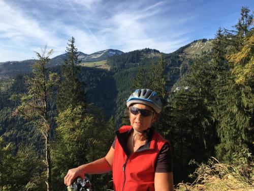a woman standing on top of a mountain at B&B Simmer in Obertraun