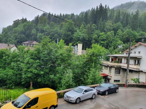 two cars parked in a parking lot next to a building at *** STUDIO 39 *** in Morbier