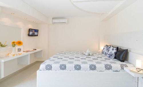 Ένα ή περισσότερα κρεβάτια σε δωμάτιο στο Plaza Pallas