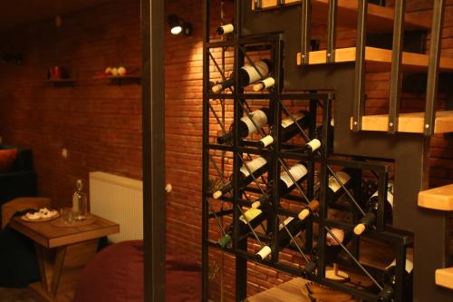 a bunch of wine bottles in a wine rack at Tbilisi Stories Hotel in Tbilisi City