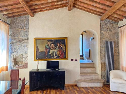 a living room with a painting on the wall at TWIN TOWER - unica al mondo - unique in the world in San Gimignano