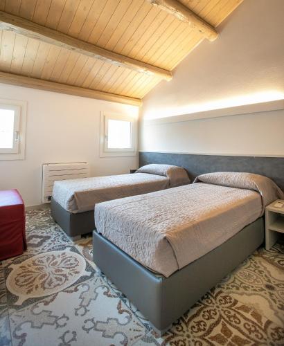 Postel nebo postele na pokoji v ubytování Casa Boscolo Family - Luxury House