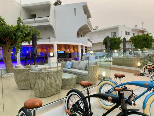 two bikes parked in front of a building at Pen&eacute;lope Hotel in Ialyssos