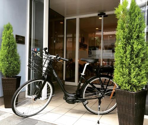 a bike parked in front of a building at Hotel Weidenhof in Regensburg