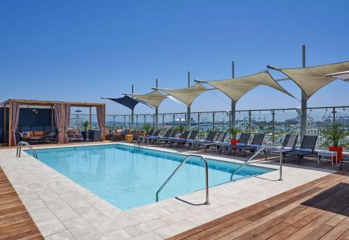 a swimming pool on the roof of a building at Hyatt Centric the Pike Long Beach in Long Beach