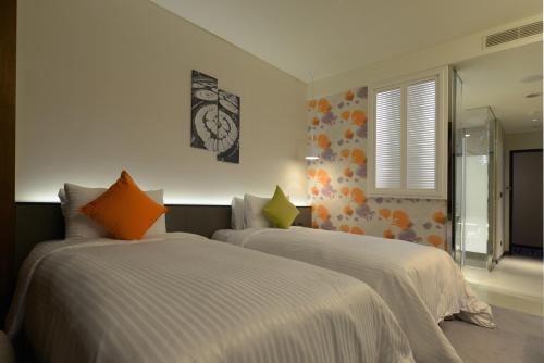 Ένα ή περισσότερα κρεβάτια σε δωμάτιο στο Golden Tulip Glory Fine Hotel