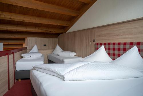 Postel nebo postele na pokoji v ubytování Aparthotel Schindlhaus und Koia Premium Apartments
