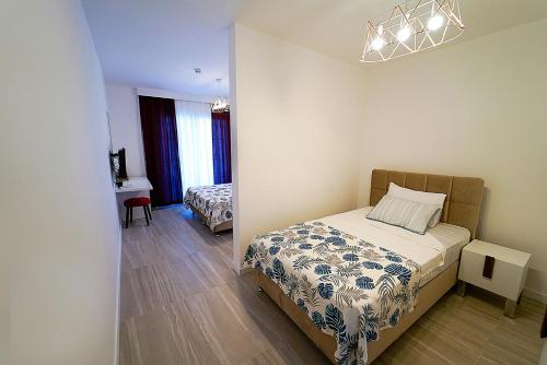 a bedroom with a bed and a desk in it at Tepehan by Özkul in Izmir