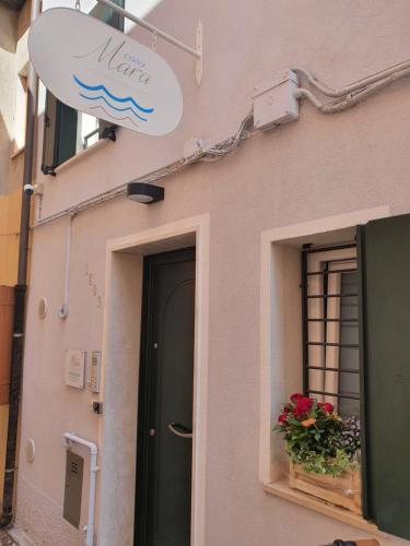 a building with a sign on the side of it at Casa Mara in Chioggia