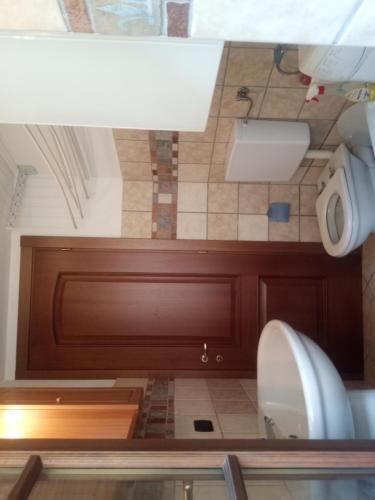 a bathroom with a toilet and a sink at casa al centro di Chatillon CIR0037 in Châtillon