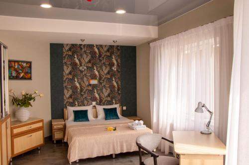 Un pat sau paturi într-o cameră la Sana Hostel