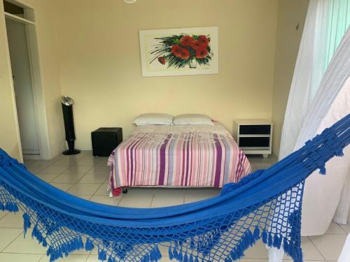 מיטה או מיטות בחדר ב-CASA LAGOA DO BANANA/CUMBUCO