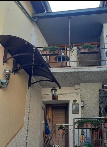 a black umbrella hanging from the side of a building at Casa Chiara in Nus