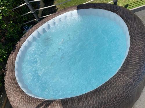 a large swimming pool with a wicker rim at Appartamento VILLA ADRY in Rome
