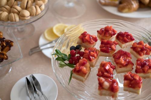 a glass plate with appetizers on a table at Villa Cattani Stuart XVII secolo in Pesaro