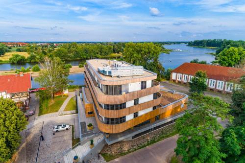 an overhead view of a building next to a river at Das ELB Boardinghouse Hotel Restaurant in Magdeburg