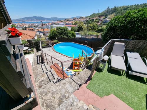 a view of a swimming pool from a house at Apartamento Vila do Mar in Baiona