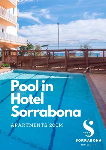 a pool in hotel sorrento apartments with a view of the ocean at Apartments Sorrabona in Pineda de Mar
